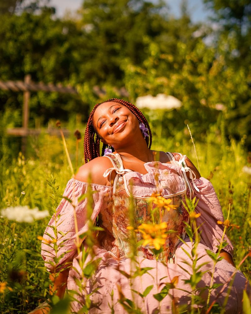 Warm golden hour natural light portrait in a wildflower field