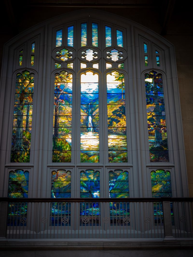 Tiffany stained glass window depicting a forest waterfall scene at the Art Institute of Chicago