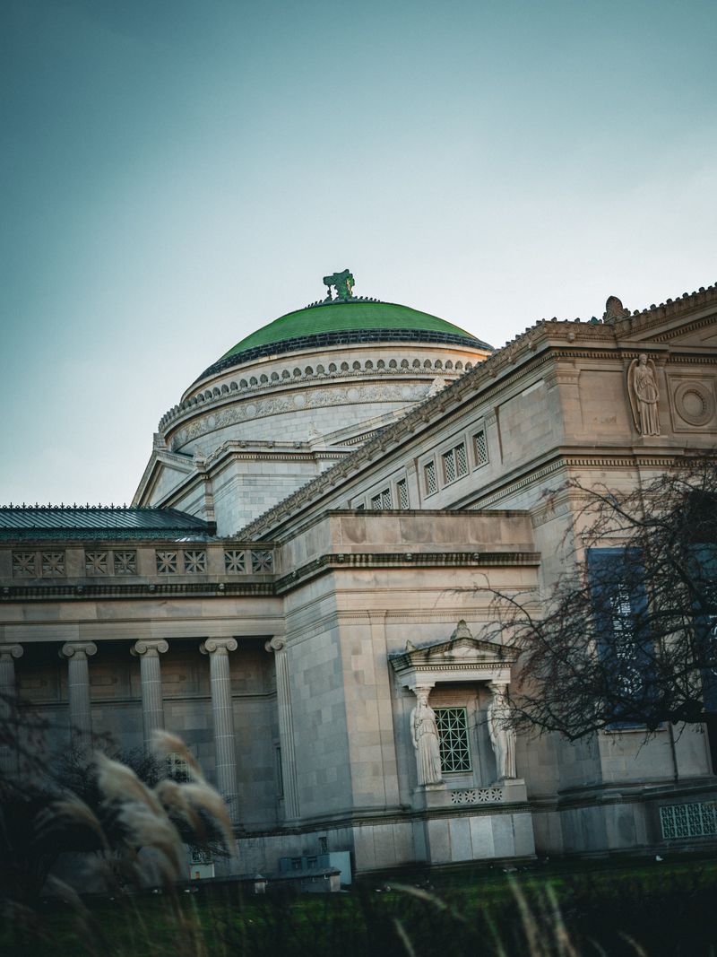 The Field Museum's green dome and classical columns in Chicago, shot from a low angle