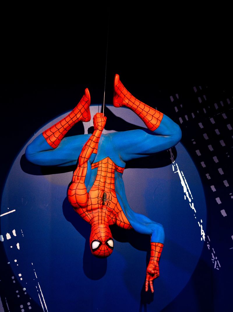 Street performer in full body paint posed upside down near Millennium Park in Chicago