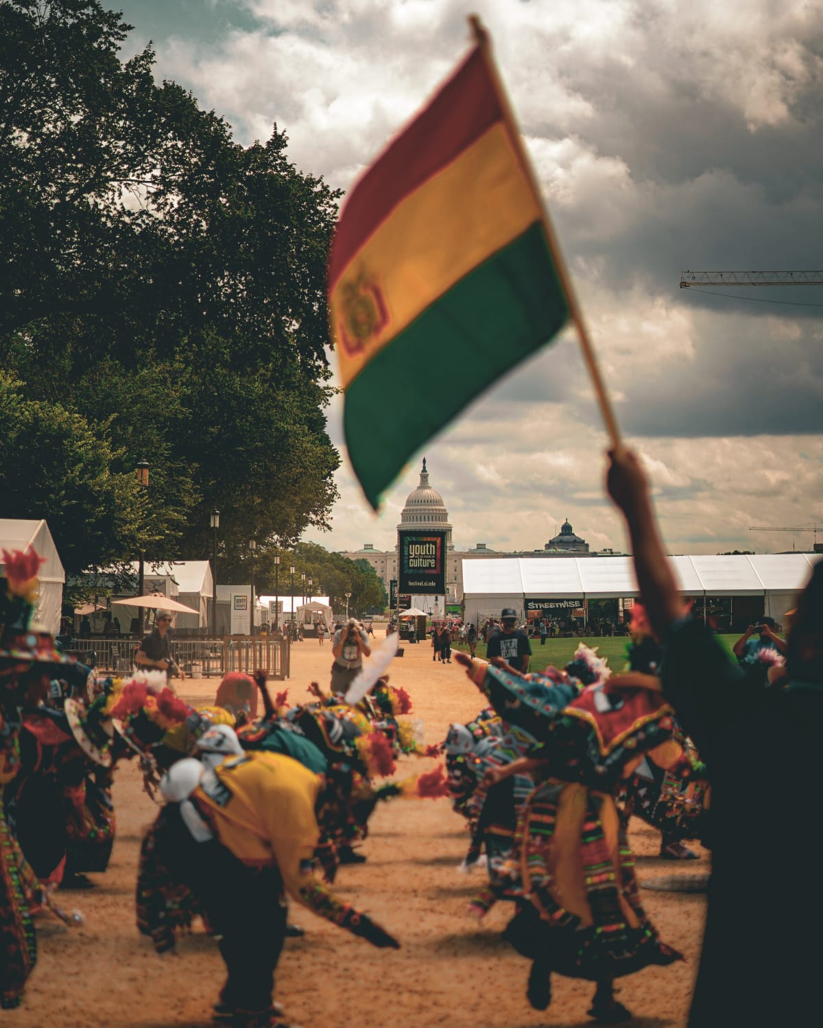 Festival street scene with yellow umbrellas